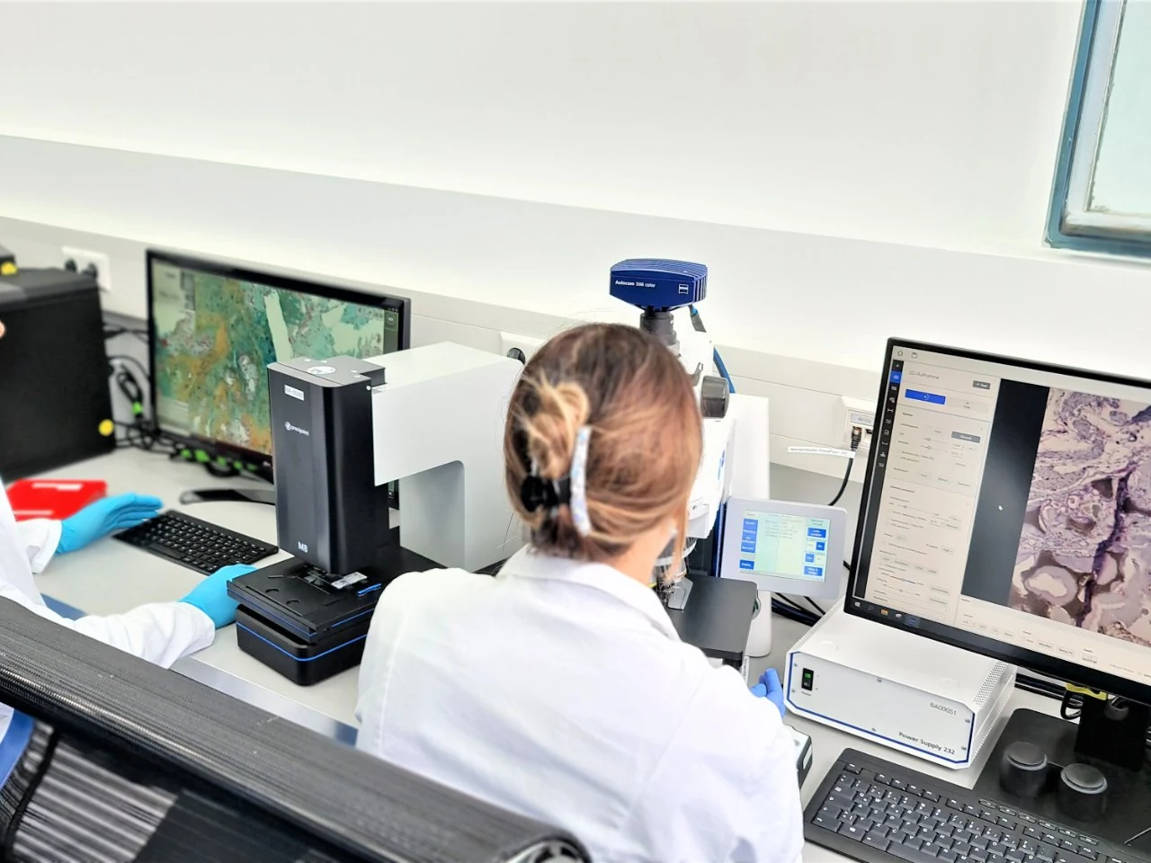 Histology team working with microscopy and whole-slide imaging